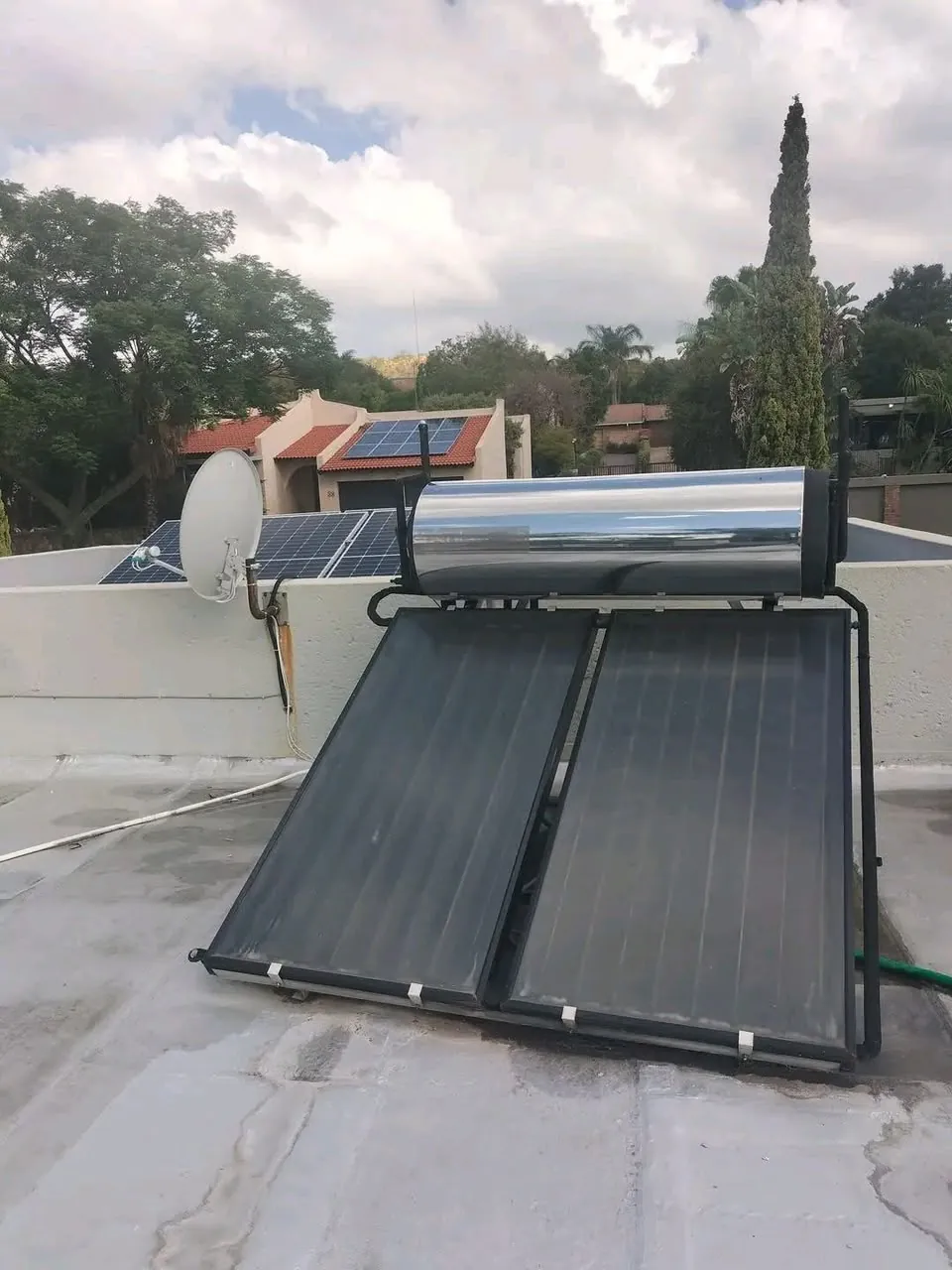 A solar geyser on a flat roof