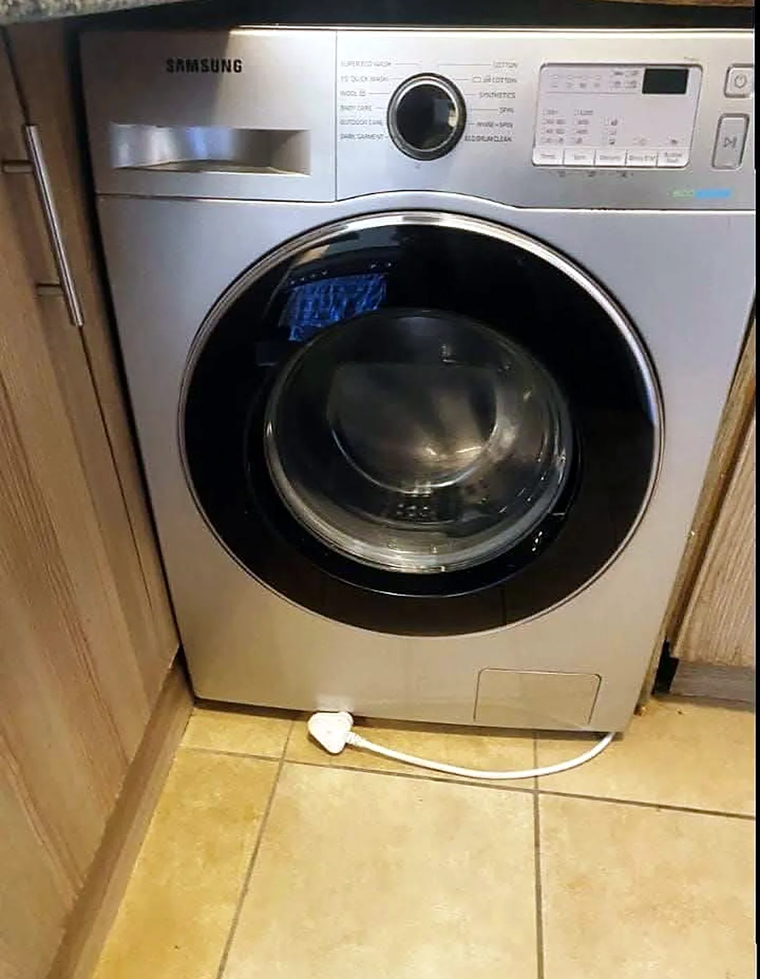 A Samsung washing machine in a kitchen